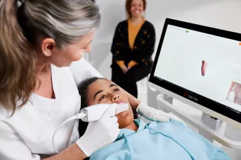 Dentist using an intraoral scanner to capture a patient’s digital impression
