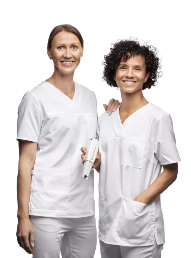 Two woman doctors with DEXIS IS 3800W in the hand
